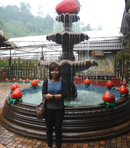 Me in front of strawberry statue