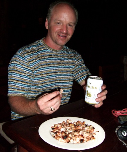 Enjoying the cashew nuts with a cold Thai beer