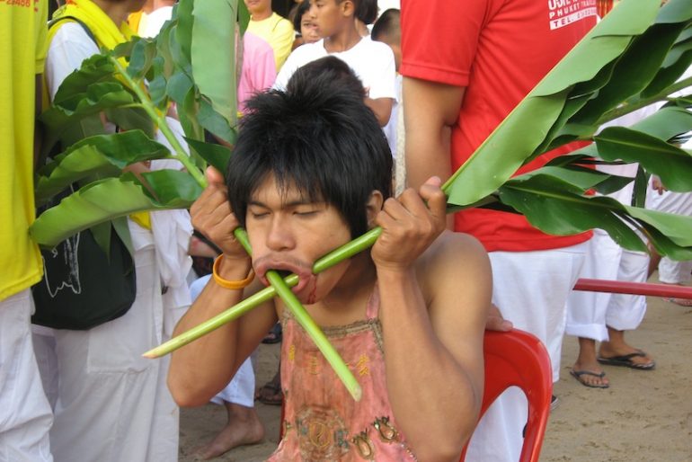 Face piercing at the Phuket vegetarian festival