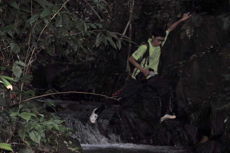 Jumping through small stream